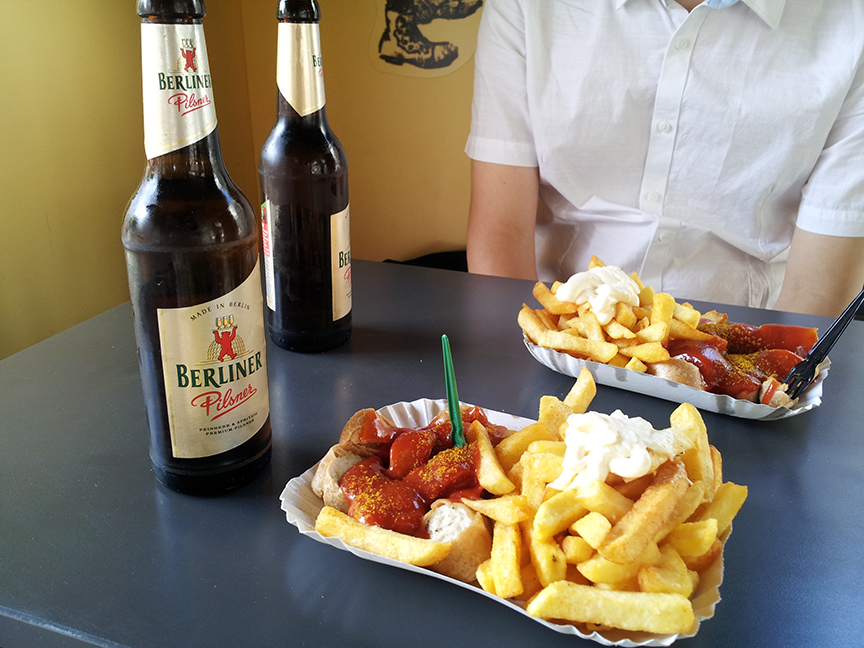 Currywurst with a bottle of beer